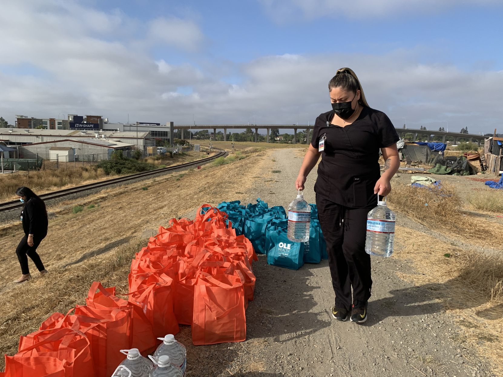 OLE Health distributes care bags to residents of the Bowl